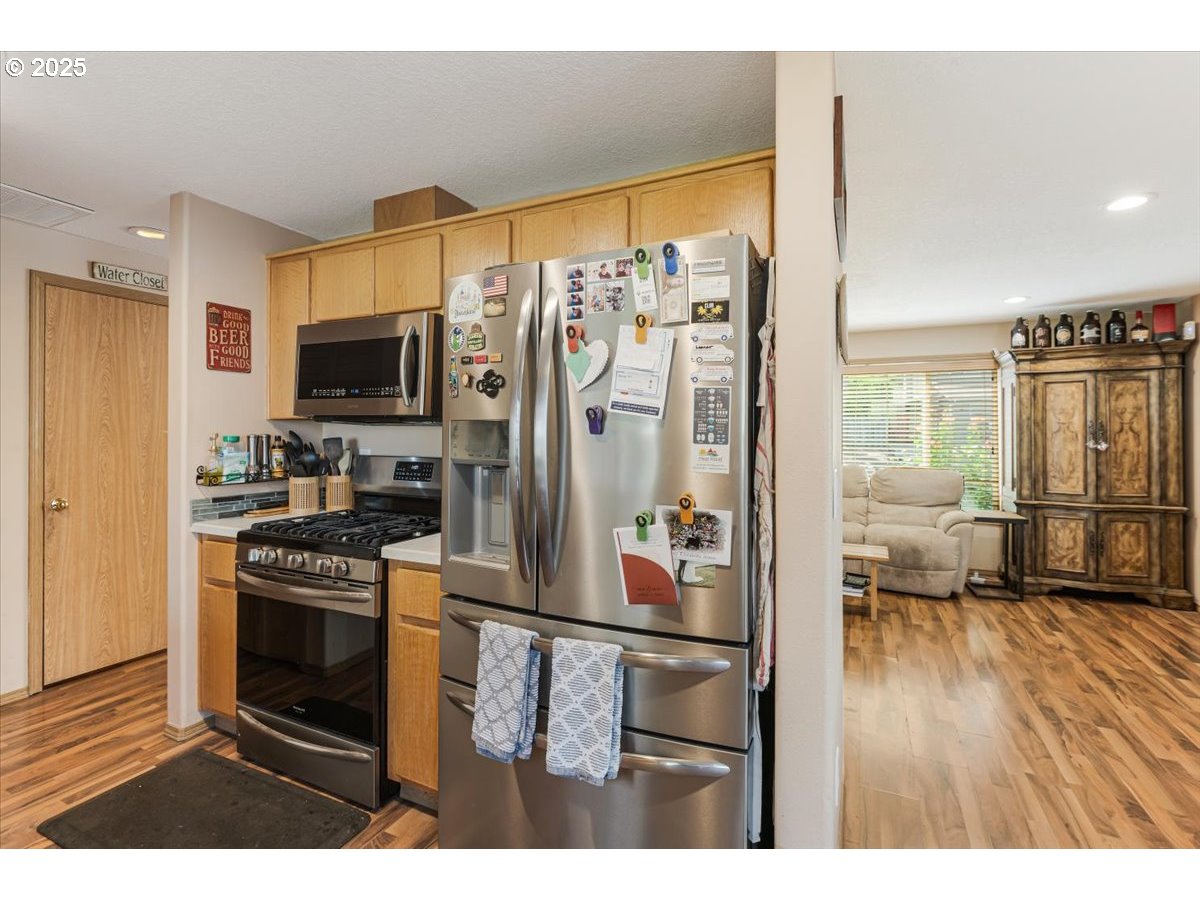 3977 Southeast Salquist Road Gresham, OR 97080 - Photo 12 of 33 a kitchen view with appliances a counter space and a window