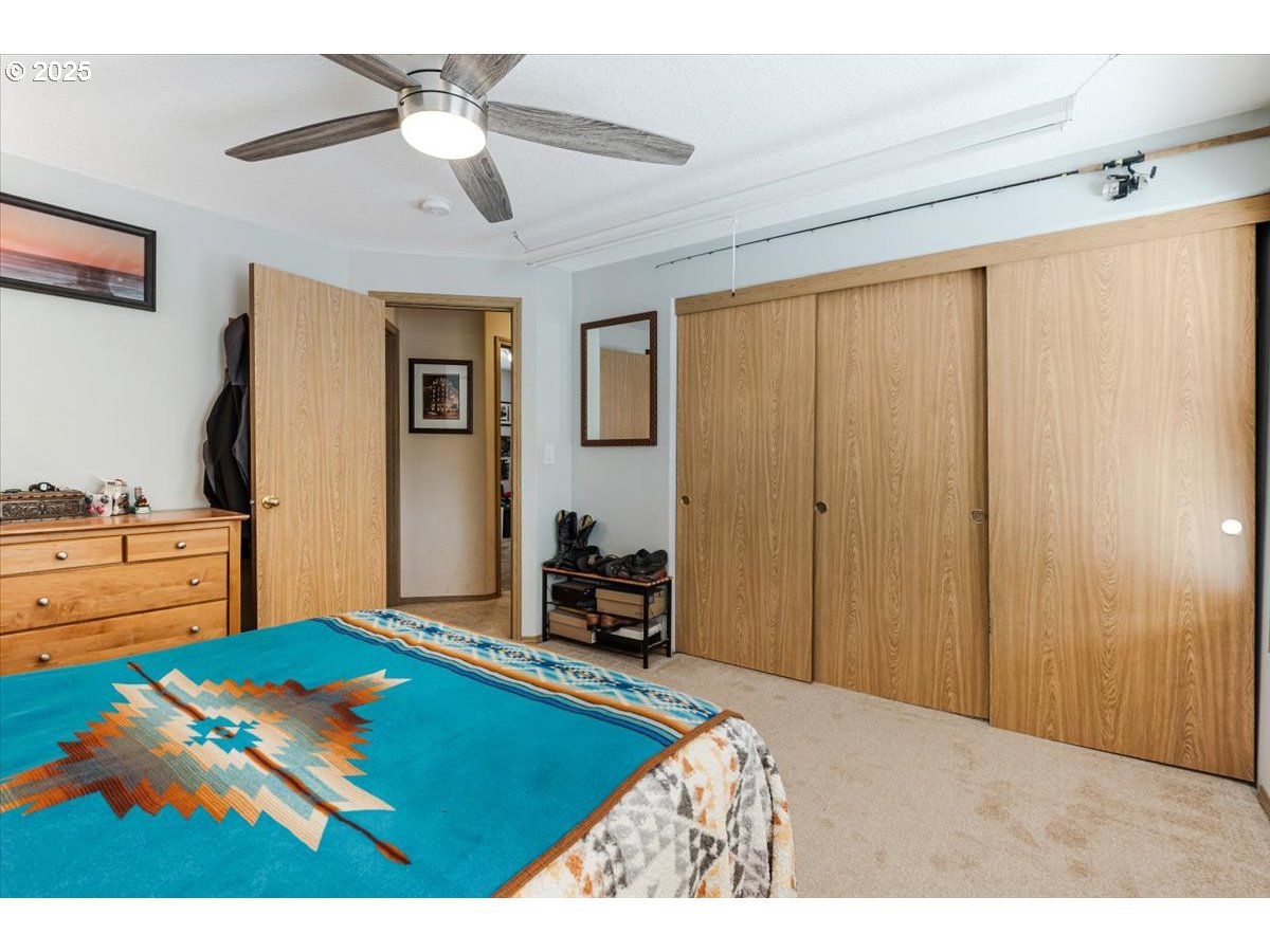 3977 Southeast Salquist Road Gresham, OR 97080 - Photo 15 of 33 a bedroom with a bed and a tv