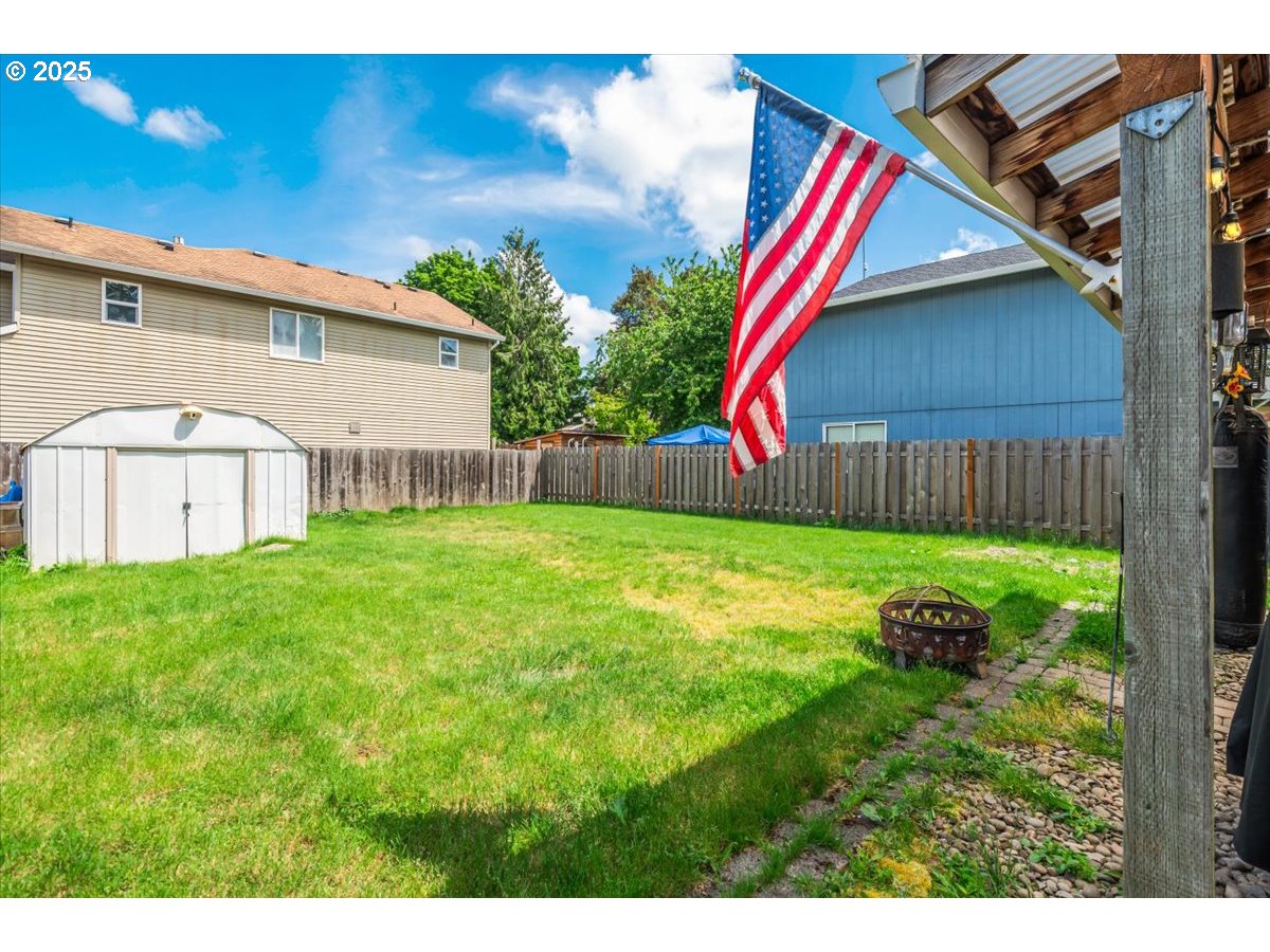 3977 Southeast Salquist Road Gresham, OR 97080 - Photo 22 of 33 a view of backyard with swimming pool and outdoor seating