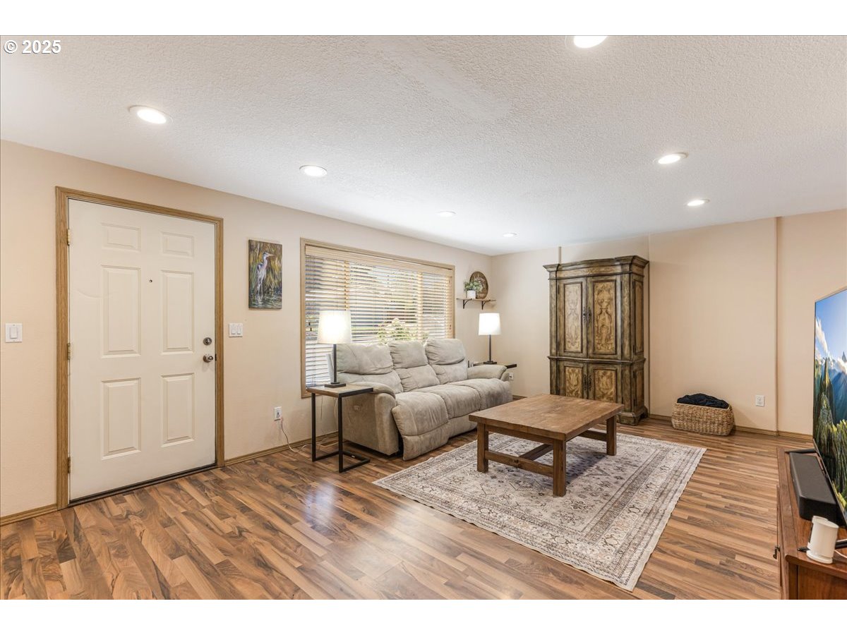 3977 Southeast Salquist Road Gresham, OR 97080 - Photo 30 of 33 a living room with furniture and a rug
