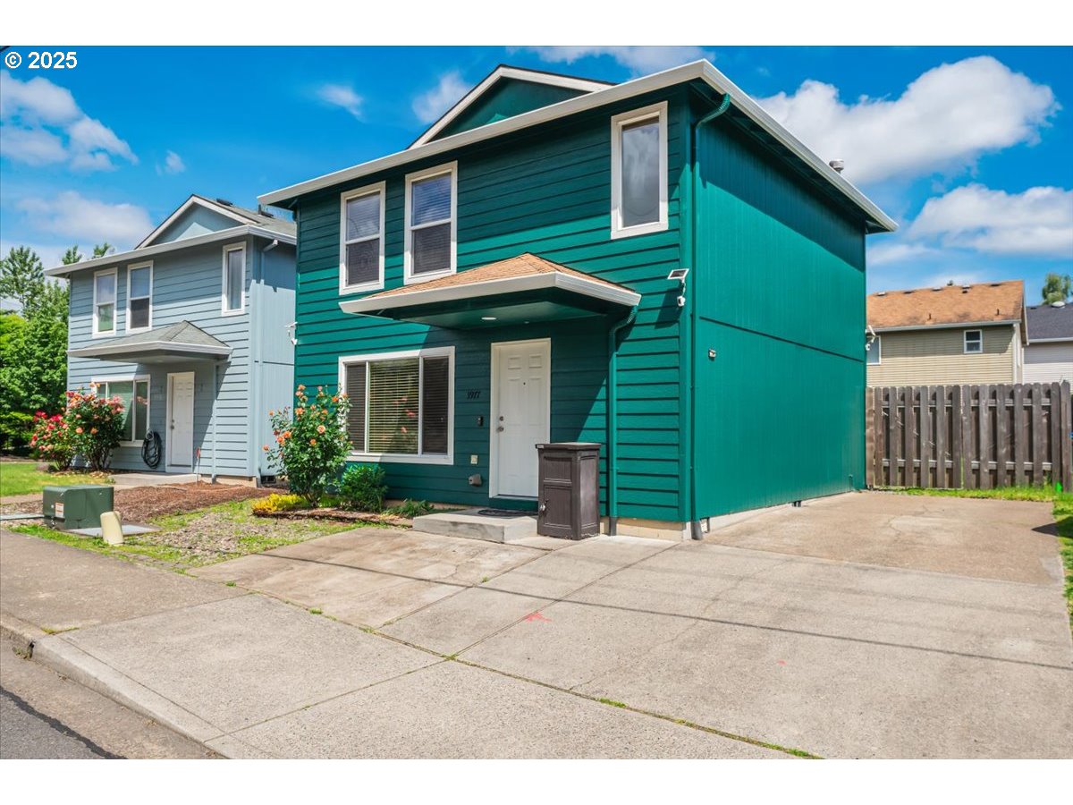 3977 Southeast Salquist Road Gresham, OR 97080 - Photo 3 of 33 a backyard of a house with yard and outdoor seating