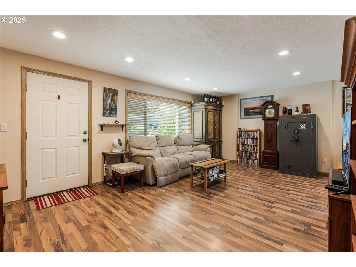 3977 Southeast Salquist Road Gresham, OR 97080 - Photo 4 of 33 a living room with furniture and a wooden floor