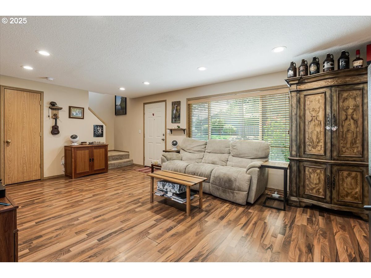 3977 Southeast Salquist Road Gresham, OR 97080 - Photo 5 of 33 a living room with furniture and a flat screen tv