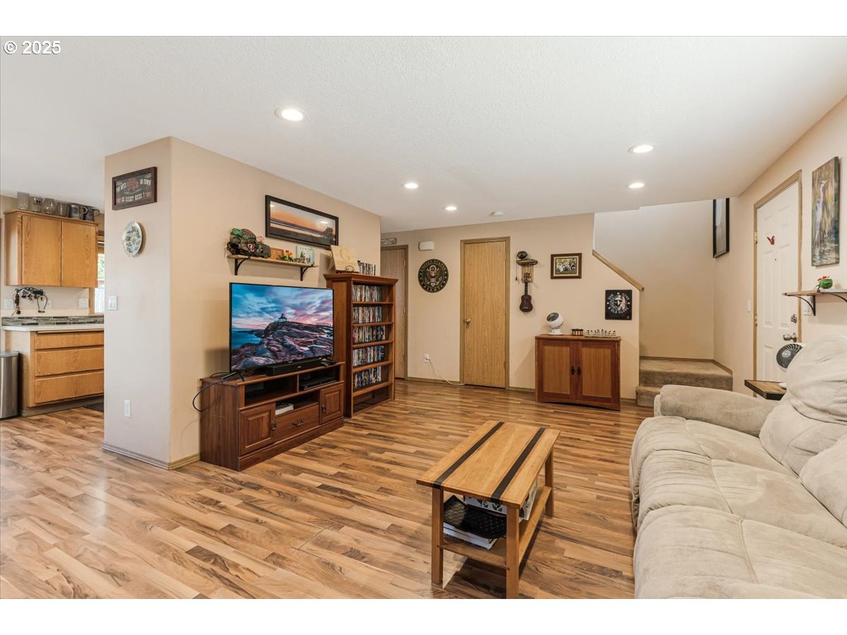 3977 Southeast Salquist Road Gresham, OR 97080 - Photo 6 of 33 a living room with furniture and a flat screen tv