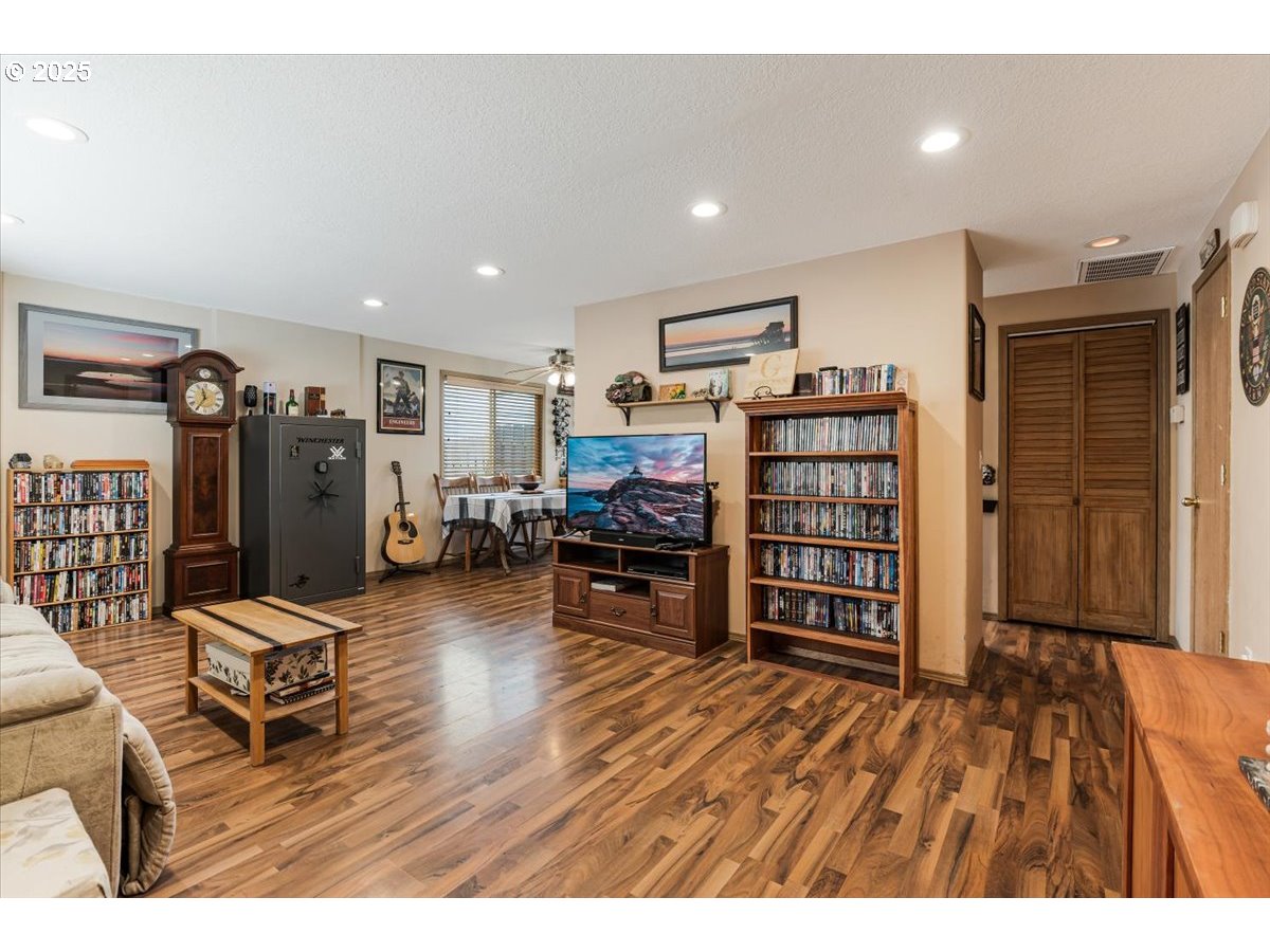 3977 Southeast Salquist Road Gresham, OR 97080 - Photo 8 of 33 a living room with furniture and a flat screen tv