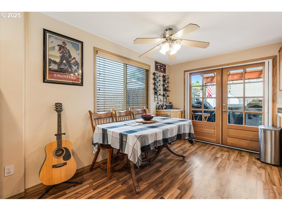 3977 Southeast Salquist Road Gresham, OR 97080 - Photo 9 of 33 a view of a livingroom with furniture window and wooden floor