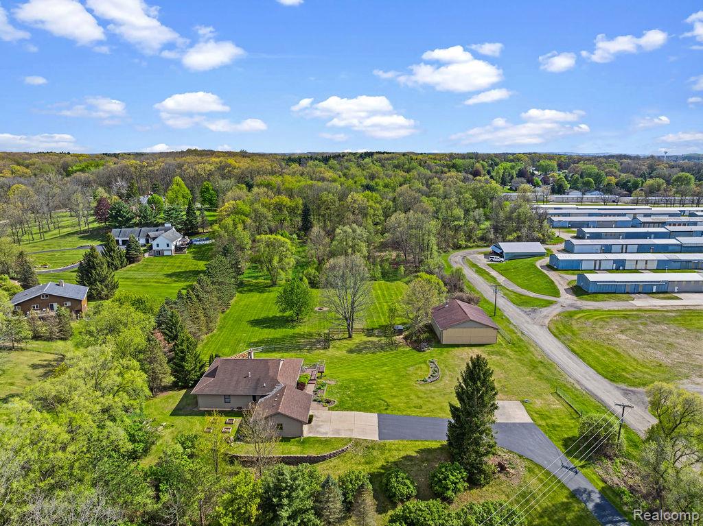 8742 Hyne Road Brighton, MI 48114 - Photo 57 of 65 Overview of rural landscape with a heavily wooded area