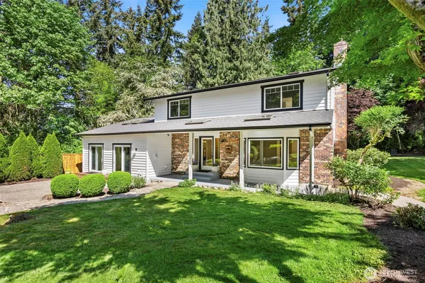 a front view of house with yard and green space