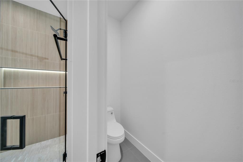 2328 Irondale Road North Port, FL 34287 - Photo 18 of 45 a white toilet sitting next to a shower