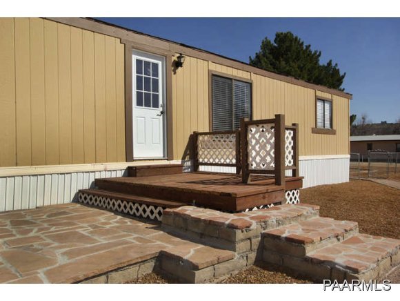 4430 East Waldron Road Rimrock, AZ 86335 - Photo 4 of 24 a bedroom with a bed and a window