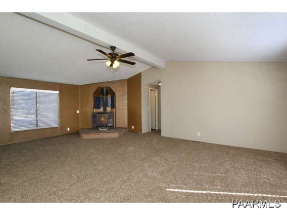 4430 East Waldron Road Rimrock, AZ 86335 - Photo 7 of 24 a view of a livingroom with a chandelier fan and window
