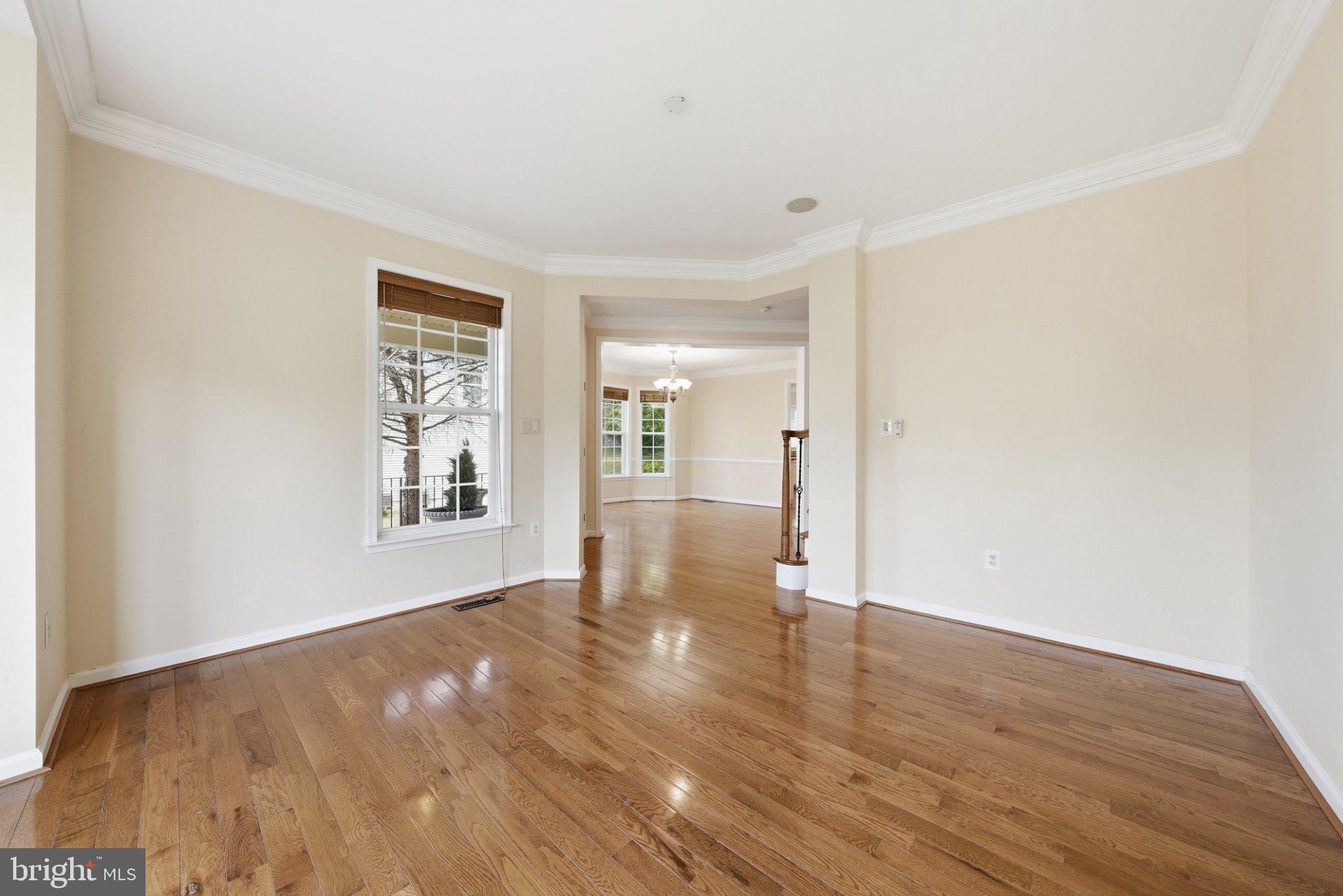 3679 Expedition Drive Triangle, VA 22172 - Photo 7 of 65 an empty room with wooden floor and windows