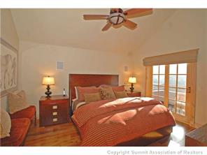 504 Ridge Street, Unit 504 Breckenridge, CO 80424 - Photo 12 of 17 a bedroom with a bed and window