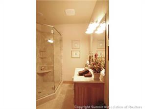 504 Ridge Street, Unit 504 Breckenridge, CO 80424 - Photo 13 of 17 a bathroom with a sink and a mirror