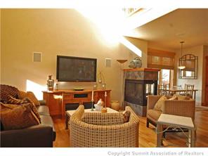 504 Ridge Street, Unit 504 Breckenridge, CO 80424 - Photo 3 of 17 a living room with furniture and a flat screen tv