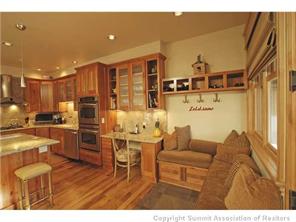 504 Ridge Street, Unit 504 Breckenridge, CO 80424 - Photo 5 of 17 a living room with stainless steel appliances kitchen island granite countertop furniture and a view of kitchen