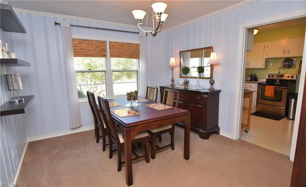 108 Kirk Road Greensboro, NC 27455 - Photo 8 of 30 Dining room has updated light fixtures.