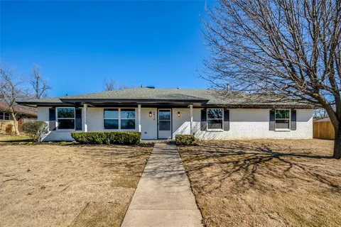 a front view of a house with yard