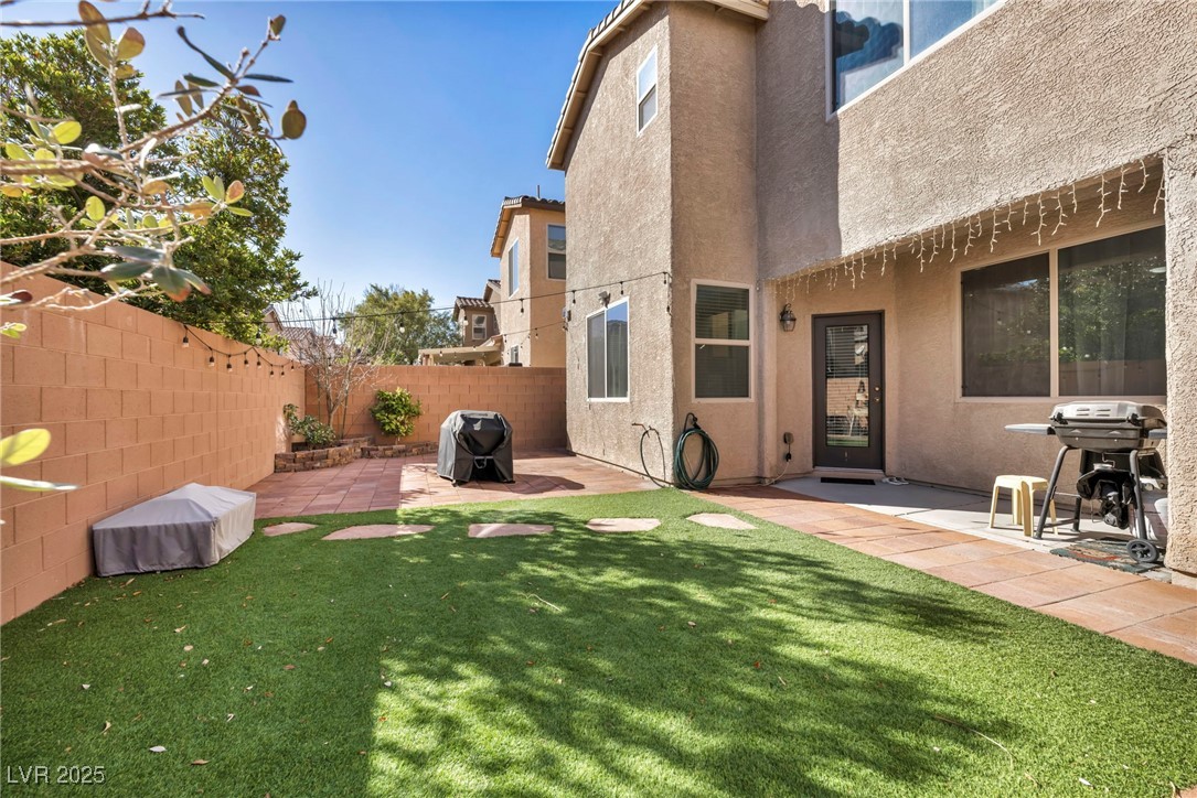 854 Earth Luster Road Las Vegas, NV 89178 - Photo 12 of 65 View of yard featuring a patio and a fenced backyard