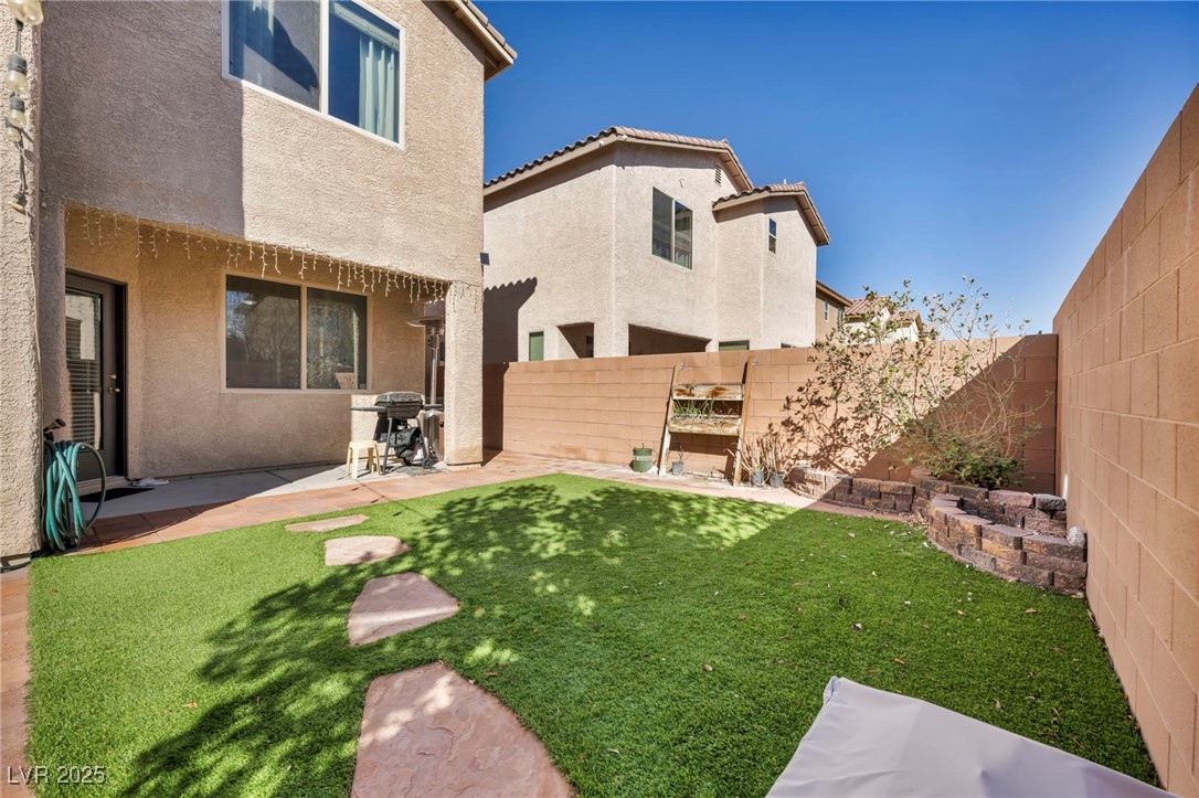 854 Earth Luster Road Las Vegas, NV 89178 - Photo 14 of 65 View of yard with a patio area and a fenced backyard