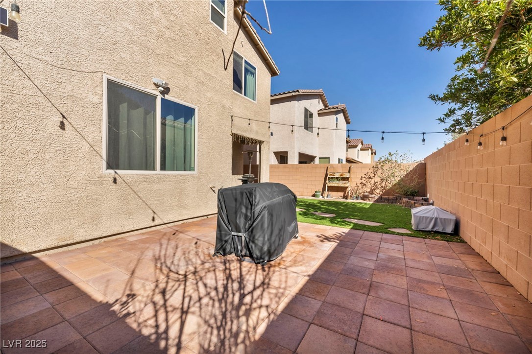 854 Earth Luster Road Las Vegas, NV 89178 - Photo 16 of 65 View of patio / terrace featuring a fenced backyard and area for grilling