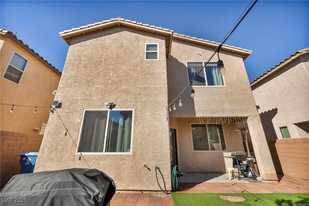 854 Earth Luster Road Las Vegas, NV 89178 - Photo 17 of 65 Back of property with fence, a patio, and stucco siding