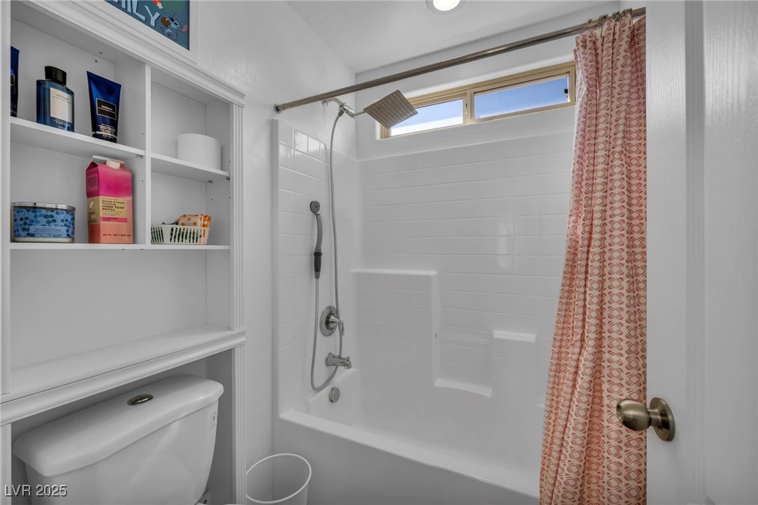 854 Earth Luster Road Las Vegas, NV 89178 - Photo 38 of 65 Full bathroom with toilet and shower / tub combo with curtain