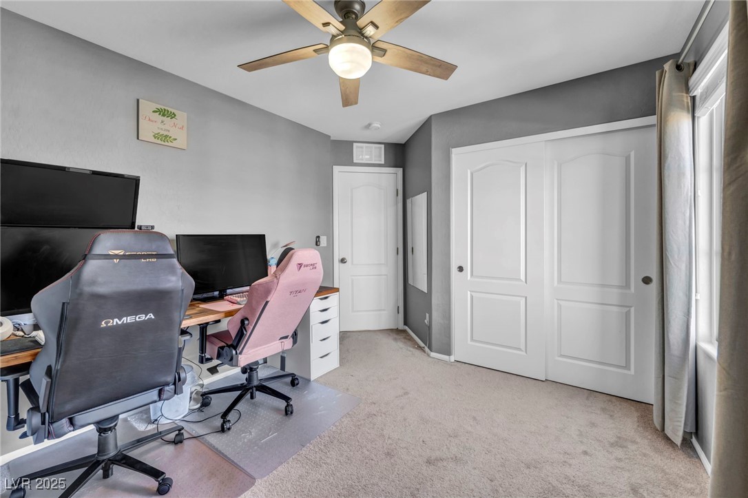 854 Earth Luster Road Las Vegas, NV 89178 - Photo 41 of 65 Office space featuring ceiling fan, baseboards, visible vents, and light colored carpet