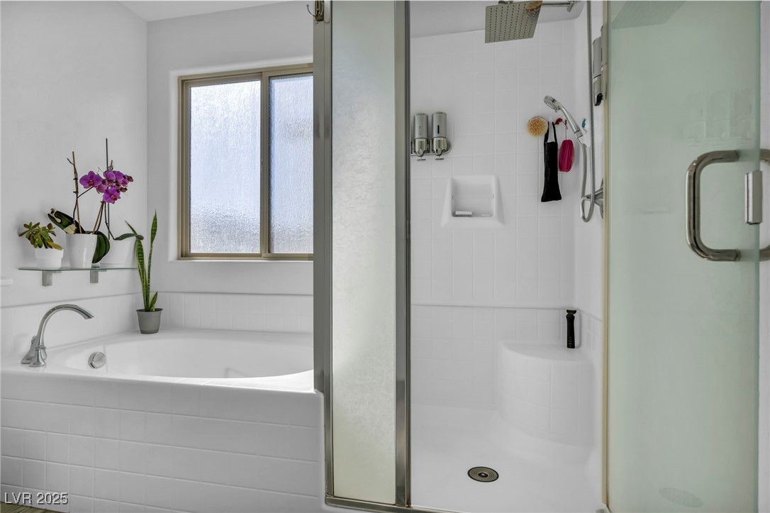 854 Earth Luster Road Las Vegas, NV 89178 - Photo 46 of 65 Full bathroom with a stall shower and a garden tub
