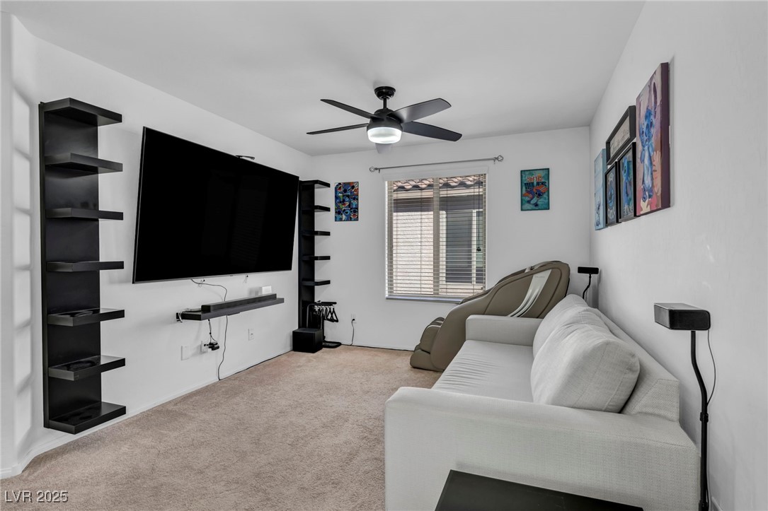 854 Earth Luster Road Las Vegas, NV 89178 - Photo 50 of 65 Living room with light carpet and ceiling fan