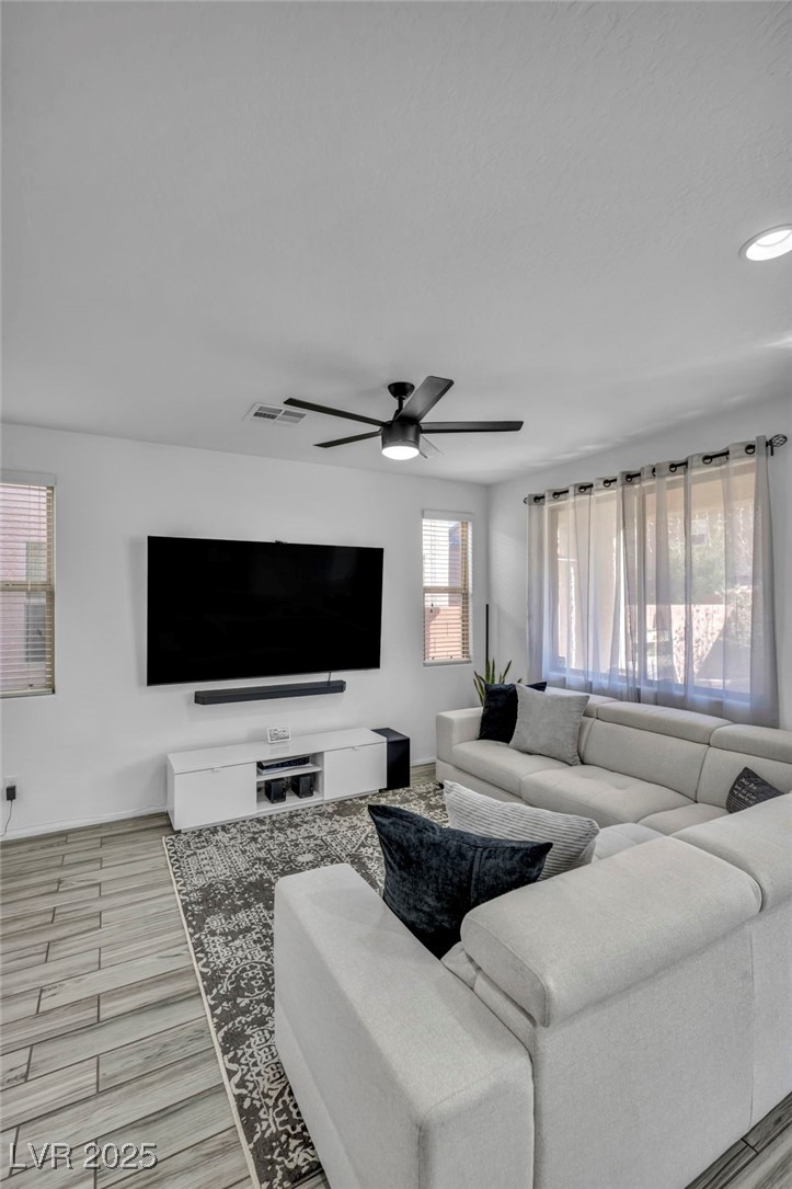 854 Earth Luster Road Las Vegas, NV 89178 - Photo 56 of 65 Living area featuring ceiling fan and visible vents
