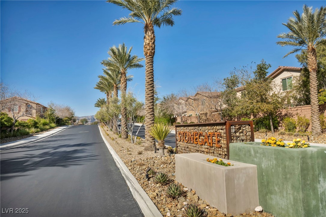 854 Earth Luster Road Las Vegas, NV 89178 - Photo 65 of 65 View of road with a residential view, curbs, and a gated entry
