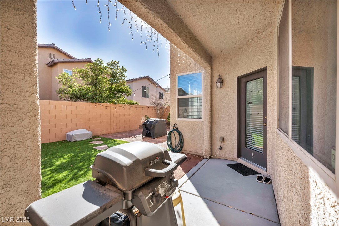 854 Earth Luster Road Las Vegas, NV 89178 - Photo 8 of 65 View of patio with fence and area for grilling