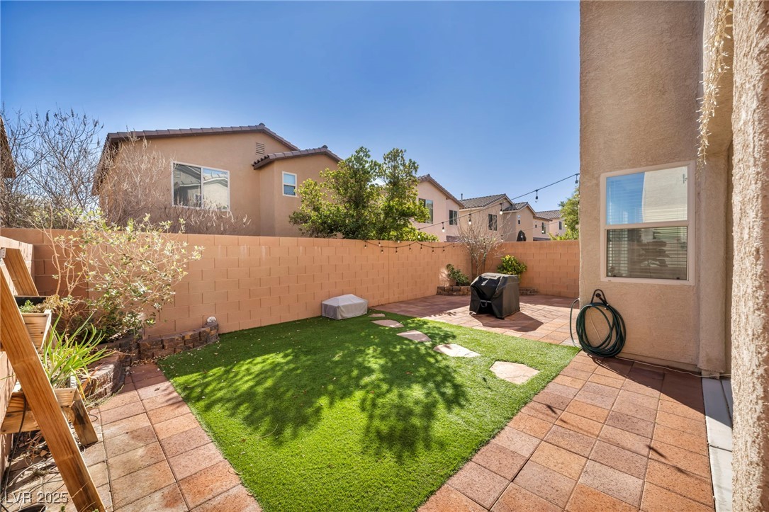 854 Earth Luster Road Las Vegas, NV 89178 - Photo 9 of 65 View of yard with a fenced backyard and a patio