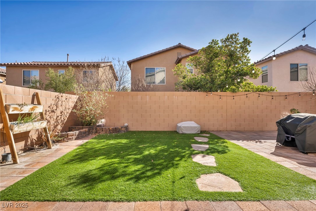 854 Earth Luster Road Las Vegas, NV 89178 - Photo 10 of 65 View of yard with a patio area and a fenced backyard
