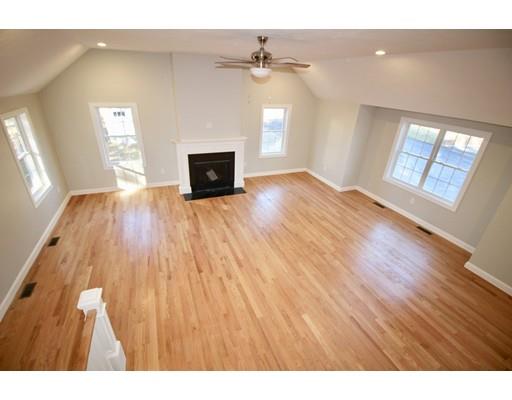 43 Bellflower Road Billerica, MA 01821 - Photo 6 of 13 a view of empty room with a fireplace and wooden floor