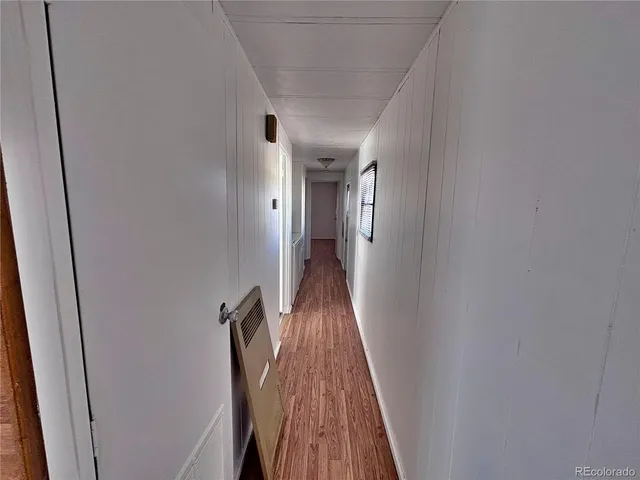 a view of gallery with wooden floor