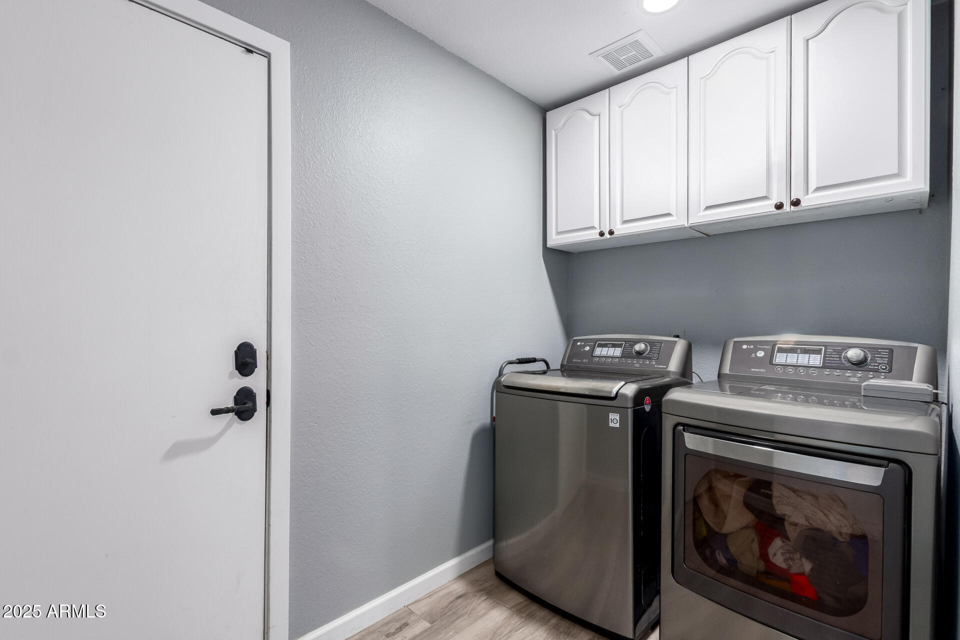 1534 East Mineral Road Gilbert, AZ 85234 - Photo 28 of 48 Inside laundry with storage