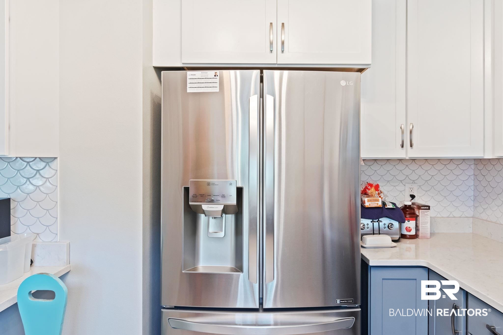 16898 Sugar Loop Foley, AL 36535 - Photo 25 of 67 Kitchen with white cabinetry, backsplash, and stainless steel fridge with ice dispenser