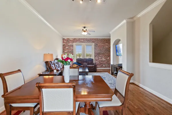 a view of a dining room with furniture window and wooden floor