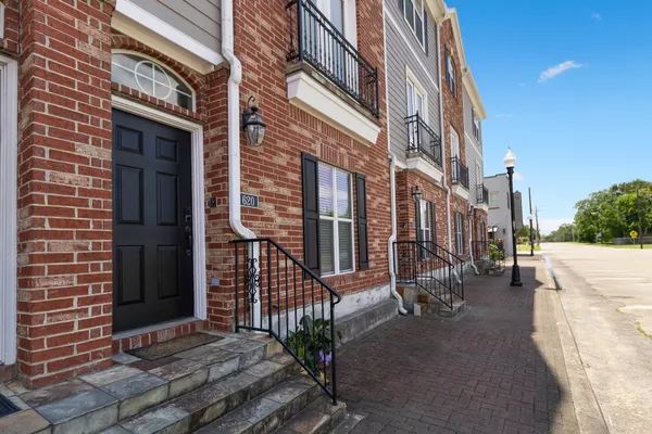 a view of a brick building with many windows