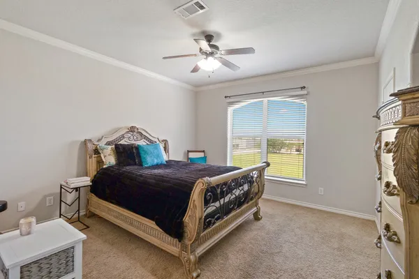 a bedroom with a bed and a table