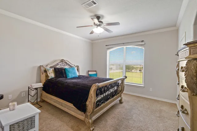 a bedroom with a bed and a table