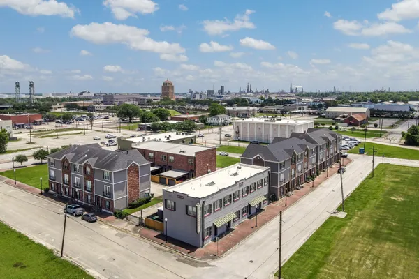 a picture of city view with lake view and houses in the back
