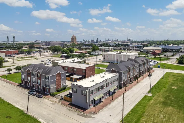 a picture of city view with lake view and houses in the back