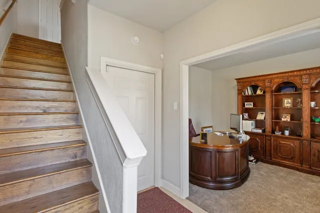 a view of entryway with workspace and stairs