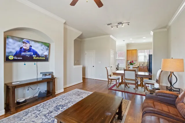 a living room with furniture and a rug