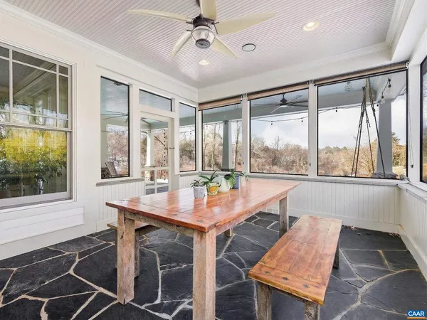 a view of livingroom with furniture flat screen tv and window