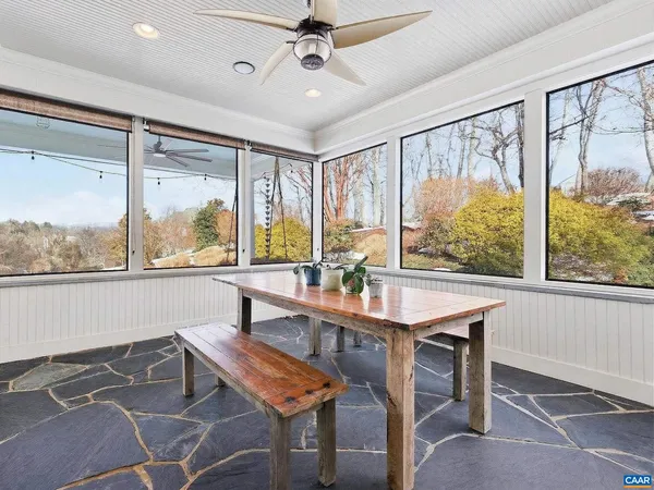 a living room with furniture tv and a flat screen tv