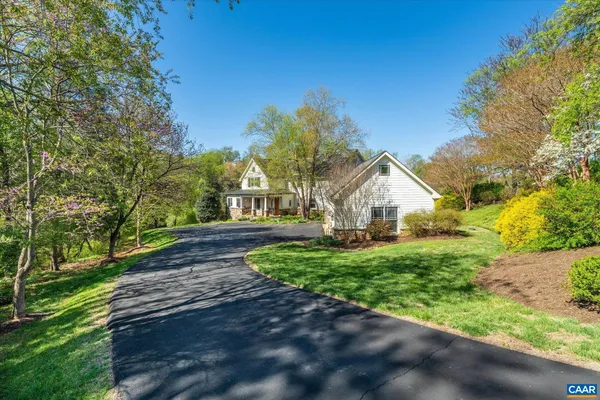 a large kitchen with stainless steel appliances granite countertop a stove and large cabinets